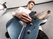 Young Man Playing Electric Guitar Royalty Free Stock Images