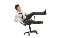 Young Man Rolling On Chiar Stock Photo