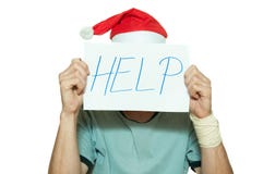 Young man with Santa Claus hat cover his face with help sign after suicidal attempt feeling lonely and sad for New Year and Christ Royalty Free Stock Photos Young man with Santa Claus hat cover his face with help sign after suicidal attempt feeling lonely and sad for New Year and Christ Royalty Free Stock Photos