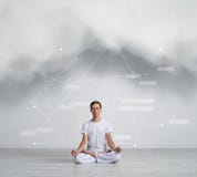 Young man sitting in Lotus position. Yoga, meditation. Stock Photos Young man sitting in Lotus position. Yoga, meditation. Stock Photos