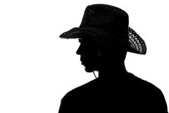 Young man in a straw hat - silhouette