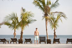 Young man in tropical resort at the Pacific Ocean stock images Young man in tropical resort at the Pacific Ocean stock images