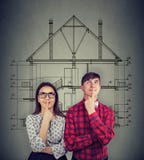 Dreaming couple planning new house sketch royalty free stock photo Dreaming couple planning new house sketch royalty free stock photo