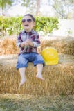 Young Mixed Race Boy Laughing with Sunglasses and Hard Hat royalty free stock photography Young Mixed Race Boy Laughing with Sunglasses and Hard Hat royalty free stock photography