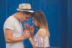 Couple enjoying juice from one glass with two drinking straws royalty free stock images Couple enjoying juice from one glass with two drinking straws royalty free stock images