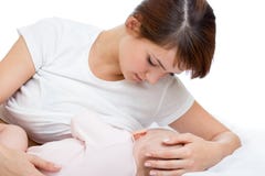 Young mother feeding breast her baby on bed stock photography Young mother feeding breast her baby on bed stock photography