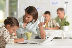 Young mother helping her cute little daughter royalty free stock photos Young mother helping her cute little daughter royalty free stock photos