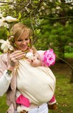 Young mother with her baby daughter in garden royalty free stock images Young mother with her baby daughter in garden royalty free stock images