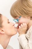 Young mother with her son playing and kissing each other stock photos Young mother with her son playing and kissing each other stock photos