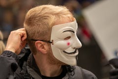 Young people dressed all in black goes out on the street to demonstrate with anonymous masks stock image Young people dressed all in black goes out on the street to demonstrate with anonymous masks stock image