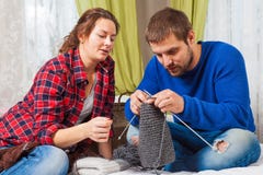 Woman is teaching knit a young man royalty free stock photos Woman is teaching knit a young man royalty free stock photos