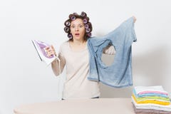 Young pretty housewife. Woman on white background. Housekeeping concept. Copy space for advertisement. stock photography Young pretty housewife. Woman on white background. Housekeeping concept. Copy space for advertisement. stock photography