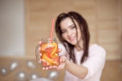 Young pretty woman holding mason jar with lemonade. royalty free stock photography Young pretty woman holding mason jar with lemonade. royalty free stock photography