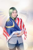 Young and pretty woman with malaysian flag over double exposure royalty free stock image Young and pretty woman with malaysian flag over double exposure royalty free stock image