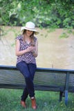 Young and pretty woman reading a message on her smartphone royalty free stock photos Young and pretty woman reading a message on her smartphone royalty free stock photos