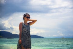 https://thumbs.dreamstime.com/t/young-relaxed-asian-chinese-woman-walking-thailand-island-beach-amazing-beautiful-turquoise-color-water-under-summer-106202332.jpg