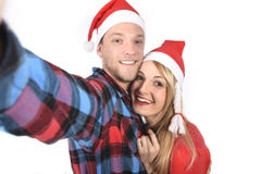 Young romantic couple in love taking selfie mobile phone photo at Christmas Royalty Free Stock Photography Young romantic couple in love taking selfie mobile phone photo at Christmas Royalty Free Stock Photography