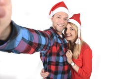 Young romantic couple in love taking selfie mobile phone photo at Christmas Royalty Free Stock Image Young romantic couple in love taking selfie mobile phone photo at Christmas Royalty Free Stock Image
