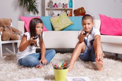 Young Siblings Watching TV Stock Photography