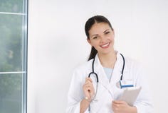 Young Smiling Doctor With Medicine Equipment Working At Hospital Stock Photography
