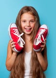 Young Smiling Girl With Red Gumshoes Royalty Free Stock Photos