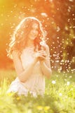 Young Spring Fashion Woman Blowing Dandelion In Spring Garden. S Stock Images Young Spring Fashion Woman Blowing Dandelion In Spring Garden. S Stock Images