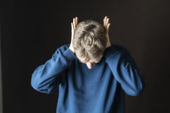Young stressed male protecting his ears from loud irritative noises f royalty free stock image Young stressed male protecting his ears from loud irritative noises f royalty free stock image