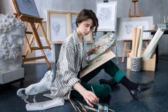 Young student artist at art workplace stock image Young student artist at art workplace stock image