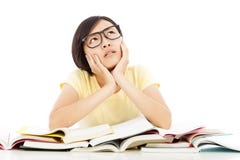 Young student girl thinking with book on the desk stock photo Young student girl thinking with book on the desk stock photo