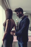 Young stylish man slide fastening woman cocktail dress royalty free stock photos Young stylish man slide fastening woman cocktail dress royalty free stock photos