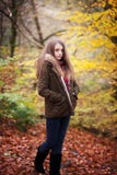 Young teenage girl standing in a forest in Autumn royalty free stock image Young teenage girl standing in a forest in Autumn royalty free stock image