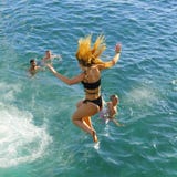 Tourists jumping to sea