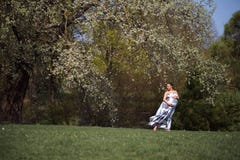 Young traveler pregnant woman walking, running, turning around and enjoys her leisure free time in a park with royalty free stock photography Young traveler pregnant woman walking, running, turning around and enjoys her leisure free time in a park with royalty free stock photography