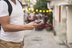 Young urban professional man using smart phone. Businessman hold ing mobile smartphone using app texting sms message. royalty free stock photography Young urban professional man using smart phone. Businessman hold ing mobile smartphone using app texting sms message. royalty free stock photography