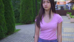 Young visually impaired asian woman with a cane is in the park close up slow mo stock video Young visually impaired asian woman with a cane is in the park close up slow mo stock video