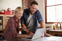 Young white couple on-line shopping in kitchen, close up Royalty Free Stock Photo Young white couple on-line shopping in kitchen, close up Royalty Free Stock Photo