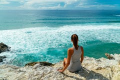 Young Woman Admiring Beautiful Landscape Of Cliffs And Ocean In Portugal stock image Young Woman Admiring Beautiful Landscape Of Cliffs And Ocean In Portugal stock image