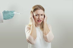 Young woman afraid of needles royalty free stock images Young woman afraid of needles royalty free stock images
