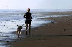 Young Woman And Dog Running Royalty Free Stock Photography Young Woman And Dog Running Royalty Free Stock Photography