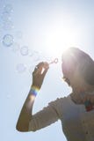 Young woman blowing soap bubbles royalty free stock photo Young woman blowing soap bubbles royalty free stock photo