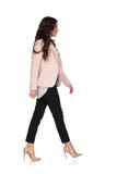 Young woman in business clothes is walking and smiles stock photos Young woman in business clothes is walking and smiles stock photos
