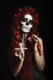 Young woman with calavera makeup (sugar skull) piercing voodoo doll Royalty Free Stock Photo Young woman with calavera makeup (sugar skull) piercing voodoo doll Royalty Free Stock Photo