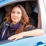 Young woman in car. Ride instruction. Automobile loan royalty free stock photography Young woman in car. Ride instruction. Automobile loan royalty free stock photography