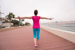 Young woman celebrating a successful training run royalty free stock photography Young woman celebrating a successful training run royalty free stock photography