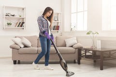 Young woman cleaning house with vacuum cleaner stock images Young woman cleaning house with vacuum cleaner stock images