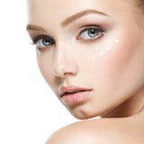Beauty face of woman with cosmetic cream on face stock images Beauty face of woman with cosmetic cream on face stock images