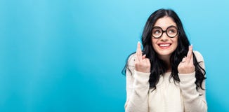 Young woman crossing her fingers royalty free stock photos Young woman crossing her fingers royalty free stock photos