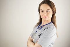 Young Woman Doctor Or Nurse Wearing Scrubs Royalty Free Stock Images