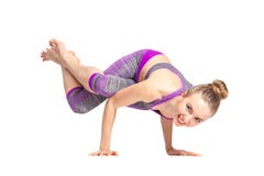 Young woman doing an asana ashtavakrasana. royalty free stock image Young woman doing an asana ashtavakrasana. royalty free stock image