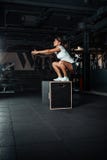 Young woman doing a box jump exercise. Stock Photo Young woman doing a box jump exercise. Stock Photo